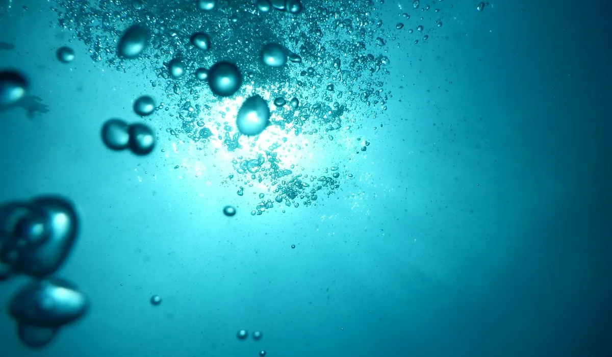 Underwater blue scene with bubbles rising through the water