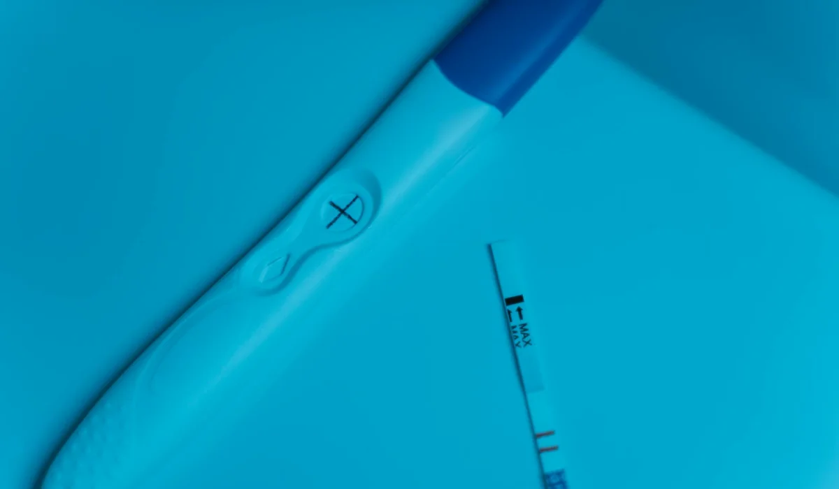 Close-up of a blue-tinted thermometer and measurement tool inside an aquarium