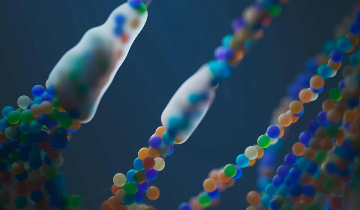 Close-up illustration of colorful, bead-like structures along wavy strands, reminiscent of DNA or bacterial molecules, representing microbiology and marketing claims.