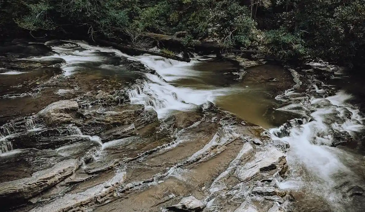 A rocky stream with layered stone steps and flowing water